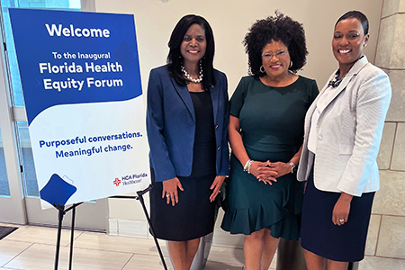 HCA Healthcare Leadership pose together at the entrance to Florida Hospital
